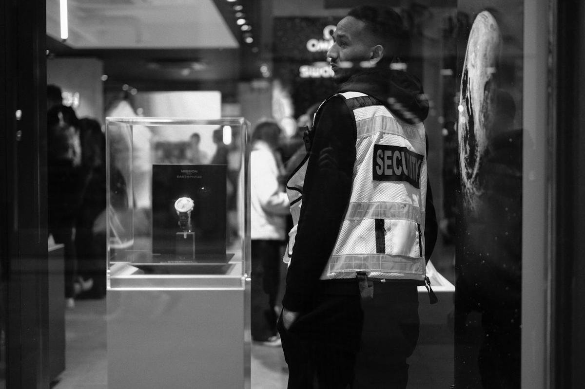 Security officer in a reflective vest inside a retail store