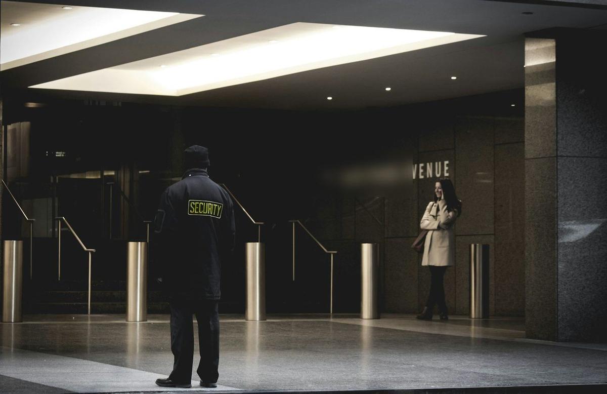 SIA security officer guarding a building entrance